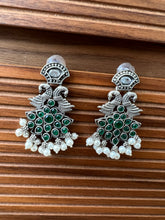 Silver bird earring with stones and pearls